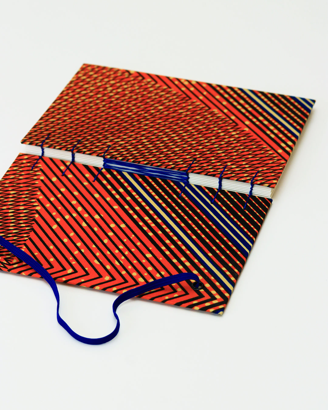 Quaderno A5 wax africano arancioni righe blu e pois beige (elastico e busta)