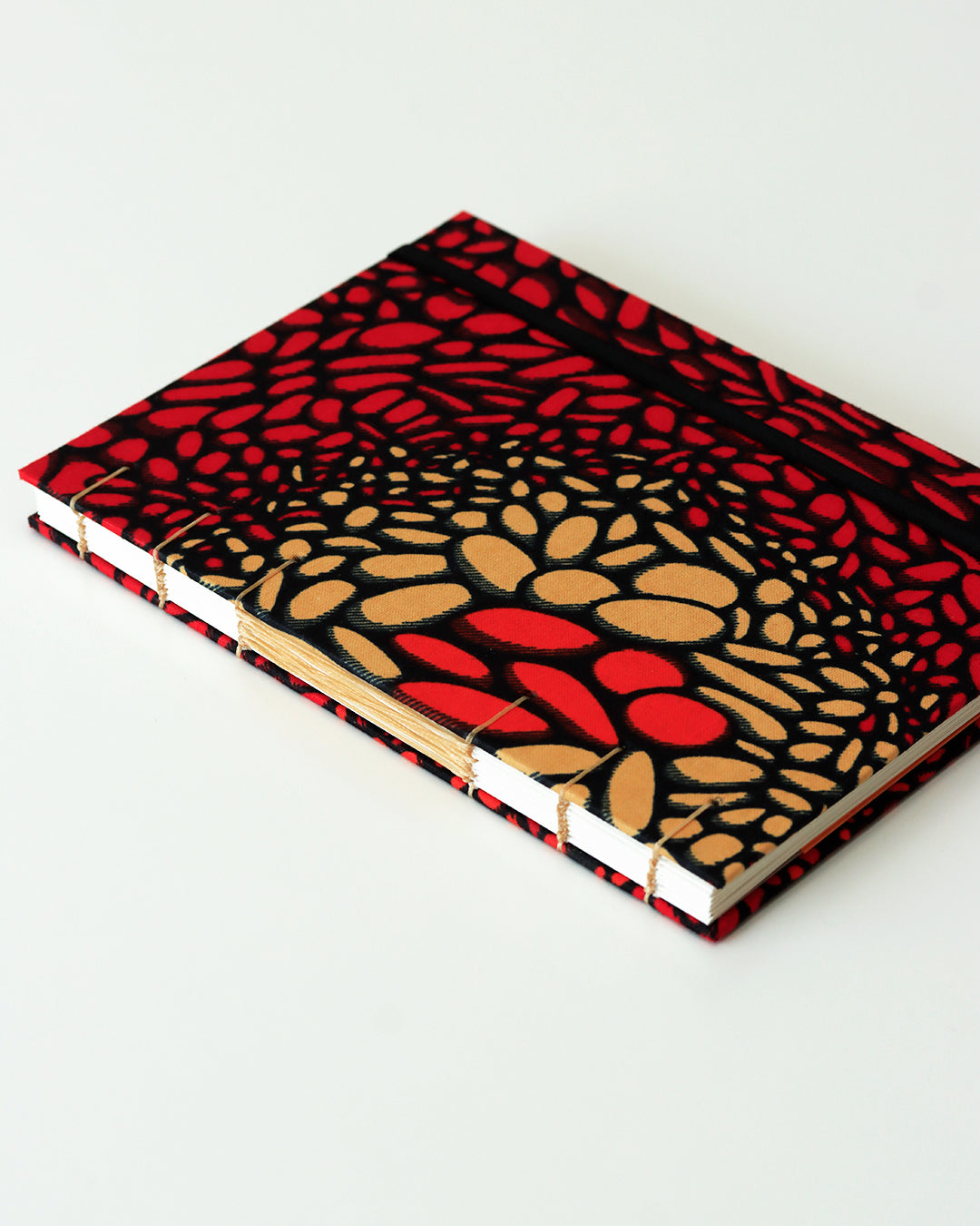 Quaderno A5 wax africano rosso e arancione lava (elastico e busta)