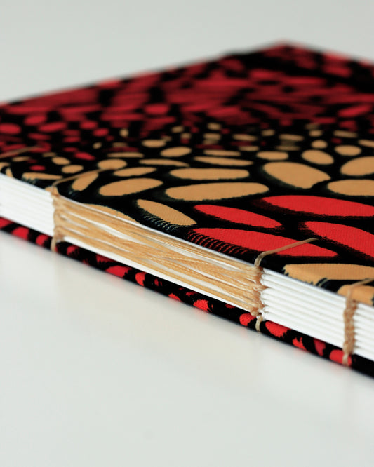 Quaderno A5 wax africano rosso e arancione lava (elastico e busta)