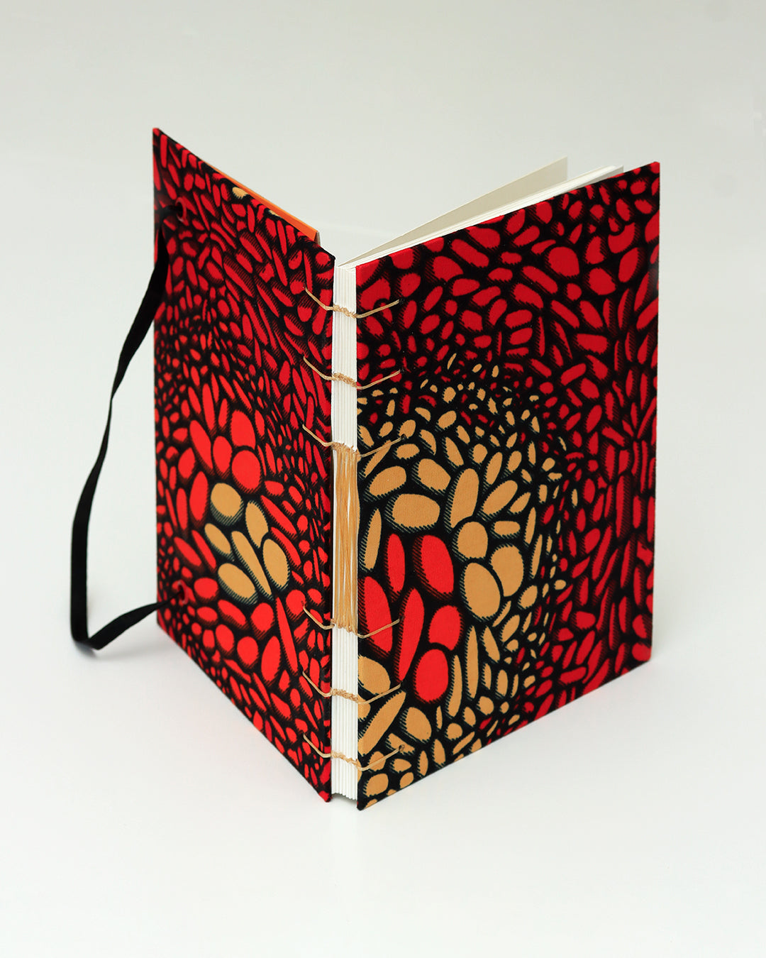 Quaderno A5 wax africano rosso e arancione lava (elastico e busta)