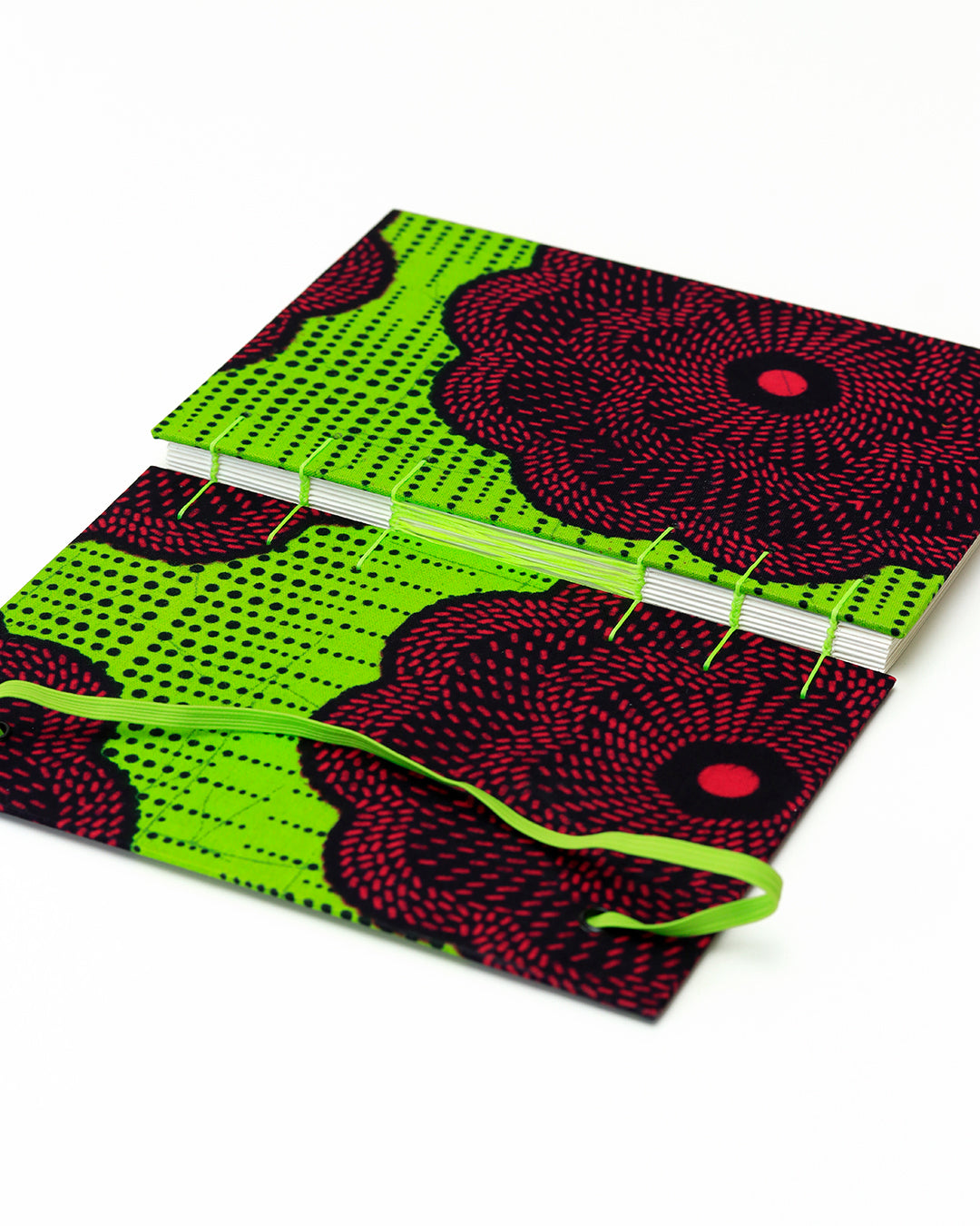 Quaderno A5 wax africano fiore fucsia su verde fluo (elastico e busta)