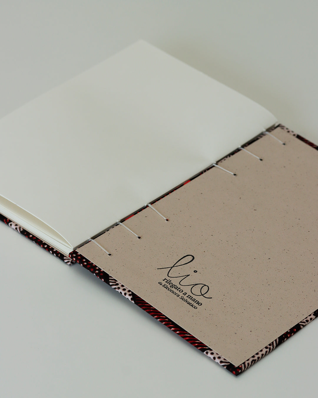 Quaderno A5 wax africano pois bianco, arancione e bordeaux
