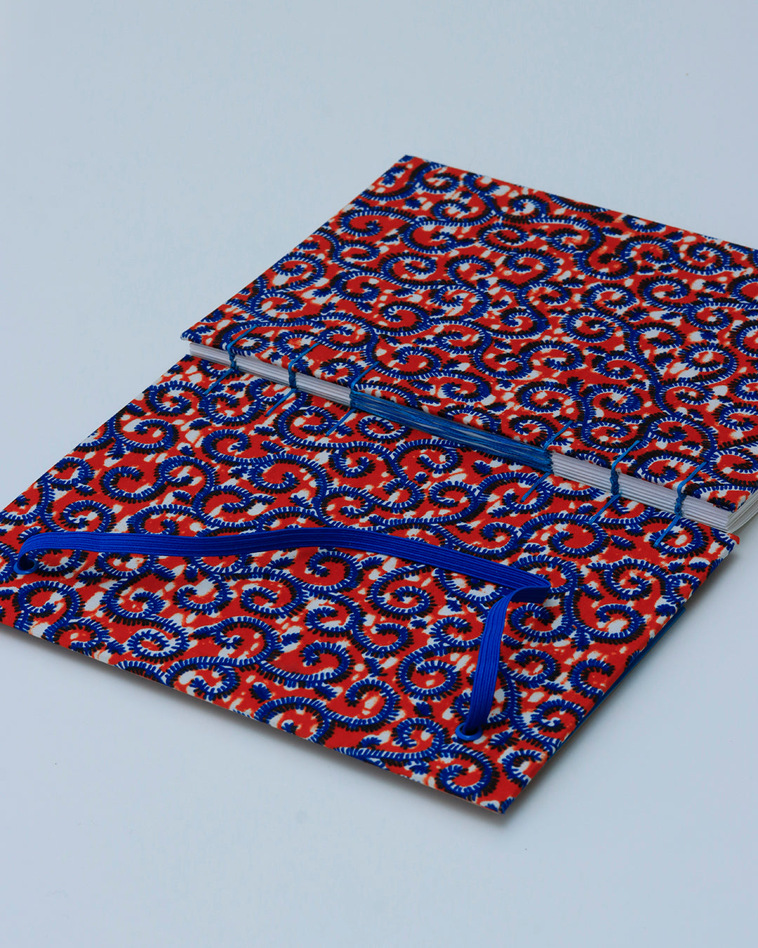 Quaderno A5 wax africano pattern ondulato arancione e azzurro (elastico e busta)