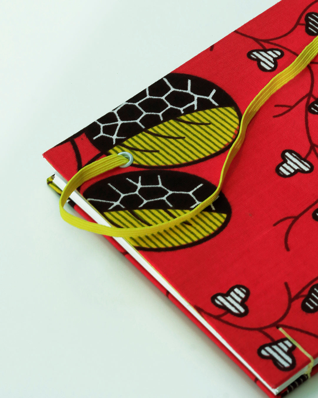 Quaderno A5 wax africano foglie fucsia e giallo (elastico e busta)