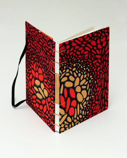 Quaderno A5 wax africano rosso e arancione lava (elastico e busta)