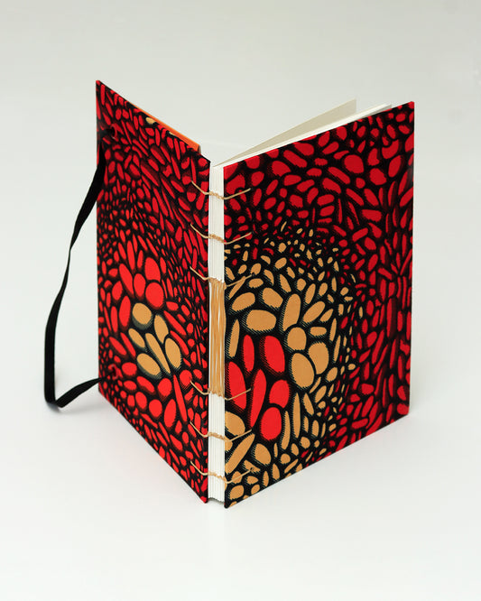 Quaderno A5 wax africano rosso e arancione lava (elastico e busta)