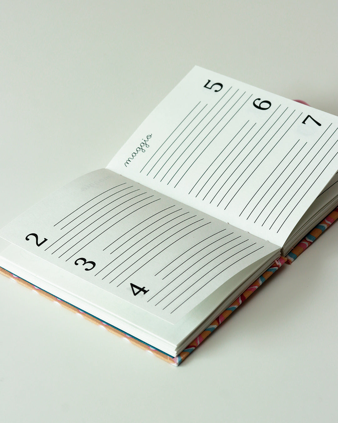 Agenda delle ricorrenze righe ondulate rosa (mix-copta francese con elastico)