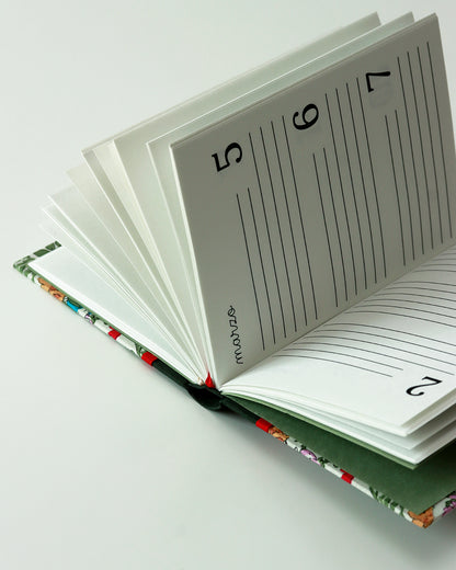 Agenda delle ricorrenze coniglietti tra narcisi e primule (dorso arrotondato)