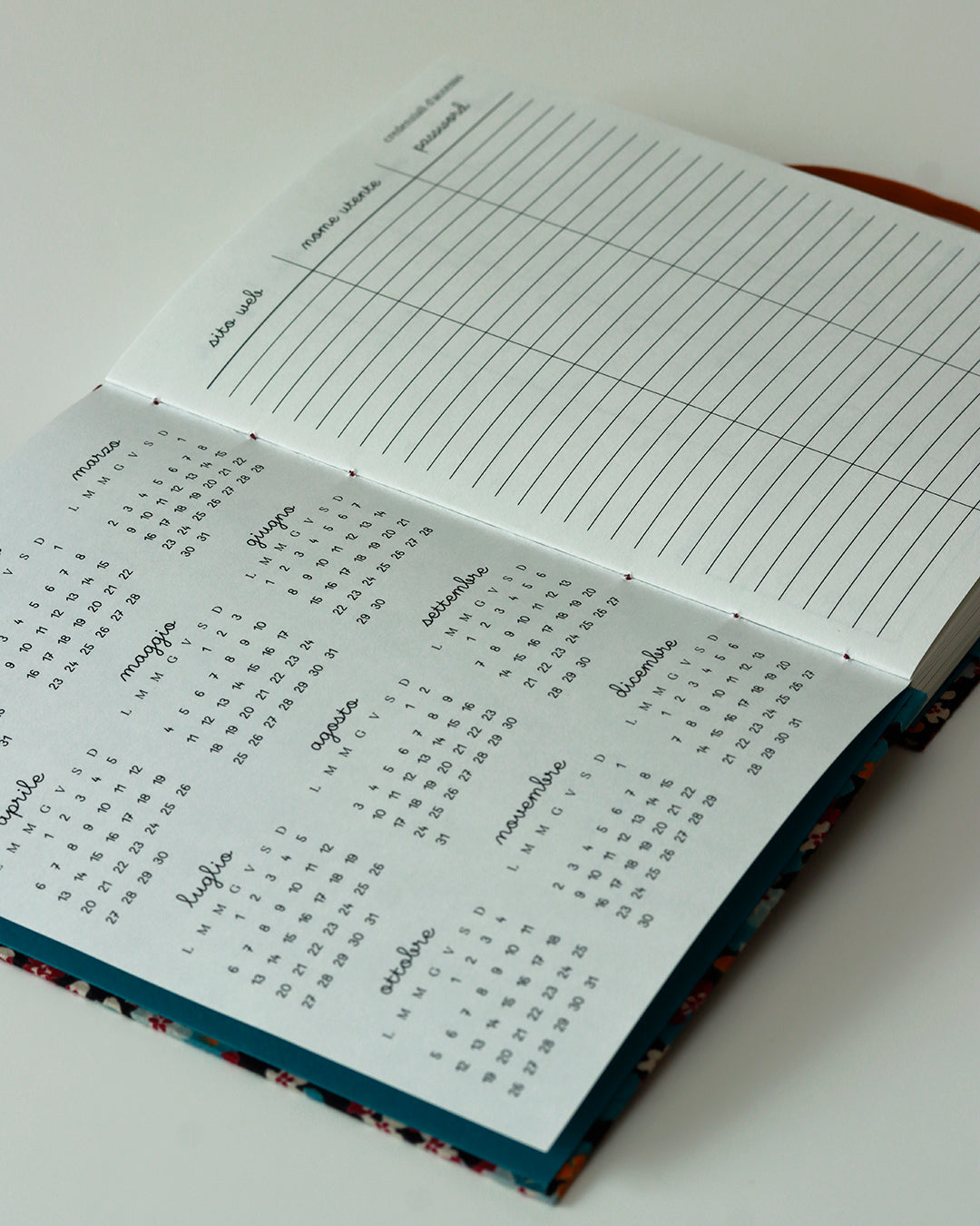 Agenda 2026 fiorellini blu-cammello-vinaccia (mix copta-francese con elastico e busta)