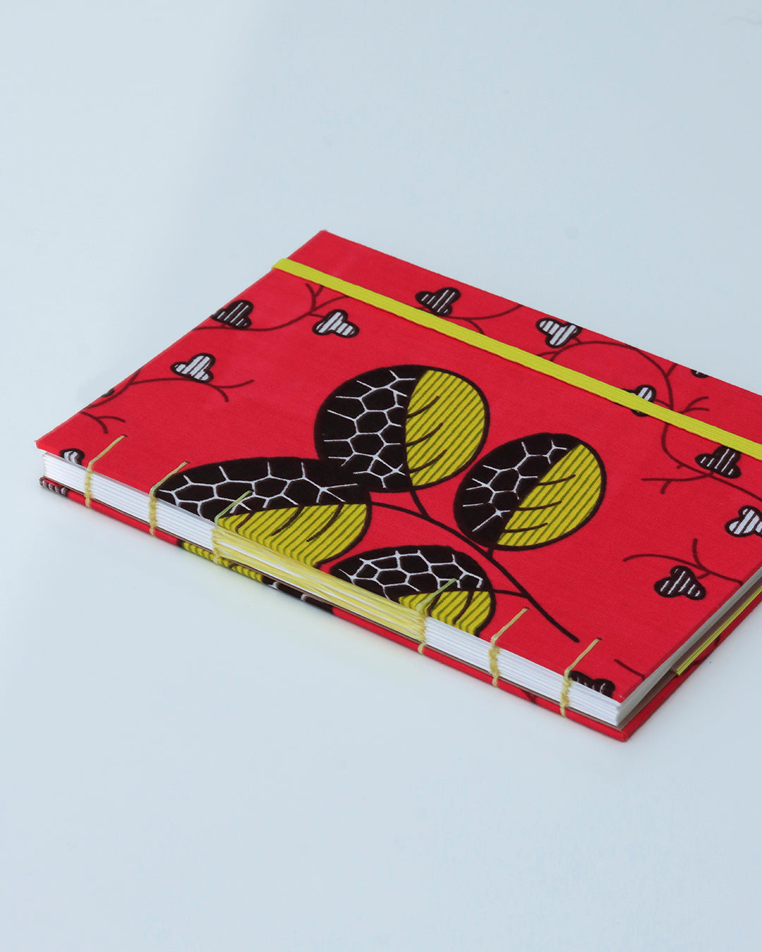 Quaderno A5 wax africano foglie fucsia e giallo (elastico e busta)